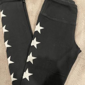 Black Hard Tail leggings with white stars down the legs! Size: xs